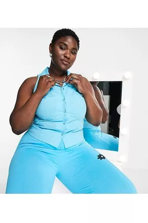COLLUSION Plus racer back sleeveless cropped shirt in blue