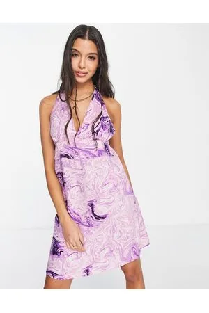 Pieces® Exclusive halterneck mini dress in bright swirl