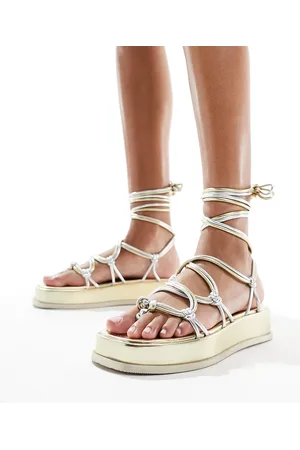ASOS Firework strappy flat sandals in metallic mix