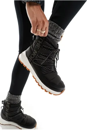 The North Face Thermoball insulated lace up boots in and white