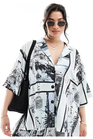 ASOS ASOS DESIGN Curve satin revere co-ord shirt in newspaper print