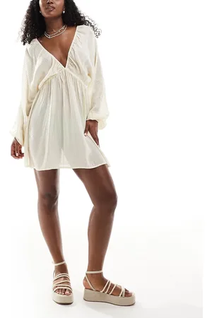ASOS Plunge long sleeve sheer mini beach dress with metallic stripes in cream
