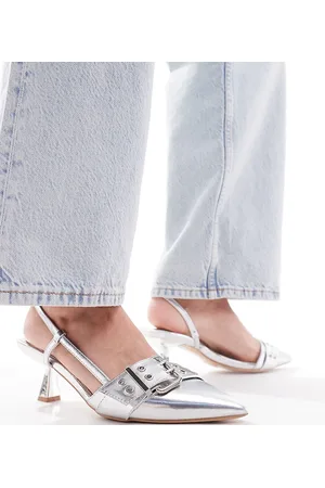 Simmi London Simmi London Wide Fit Dala pointed kitten heel sling backs with eyelet buckle detail in metallic