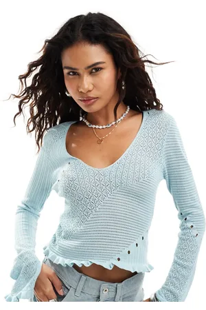 Monki Small rib v neck knit long sleeve top with hem detail in