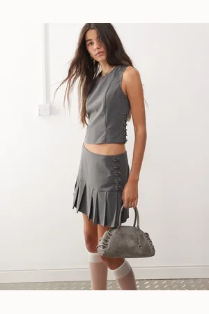 COLLUSION Pleated mini skirt with piercing detail co-ord in pinstripe