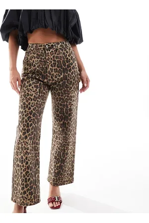 Never Fully Dressed Petite scallop pocket detail jeans in leopard print