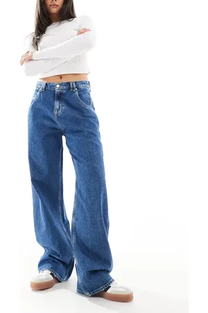 Tommy Hilfiger Daisy low baggy jeans in mid wash