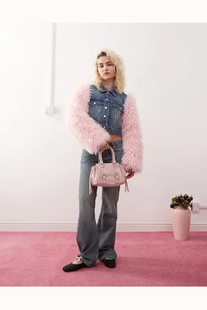Monki Denim jacket in mid wash with pink faux fur sleeves