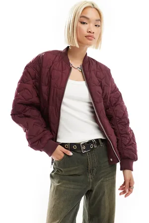 Monki Reversible oversized bomber jacket in burgundy quilted star and pink