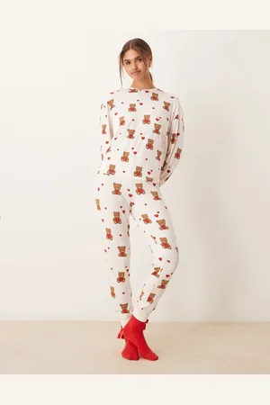 Urban Threads Christmas poly long sleeve revere top and trouser pyjama set in festive print