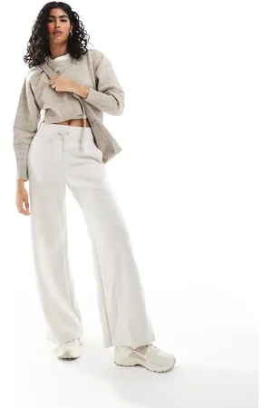 Nike Phoenix fleece wide leg joggers in beige