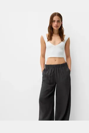 Bershka Petite drawstring waist wide leg trousers in dark check