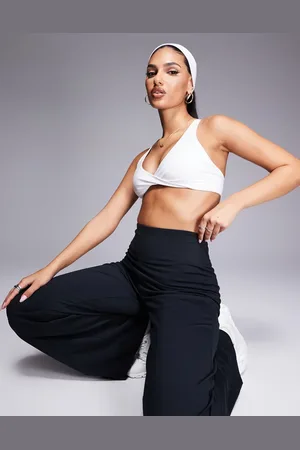 ASOS 4505 soft touch light support twist front sports bra in