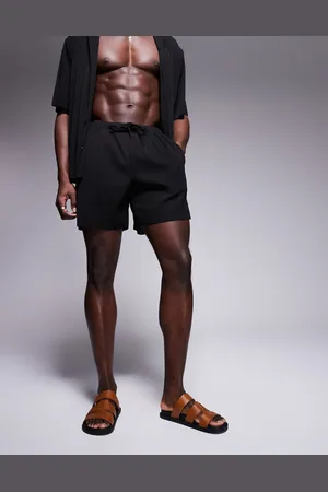 ASOS Co-ord plisse swim shorts in mid length in black