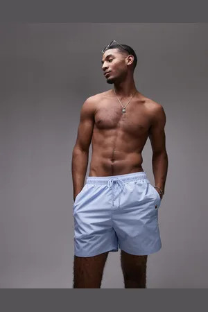 Tommy Hilfiger Side logo drawstring swim shorts in pale
