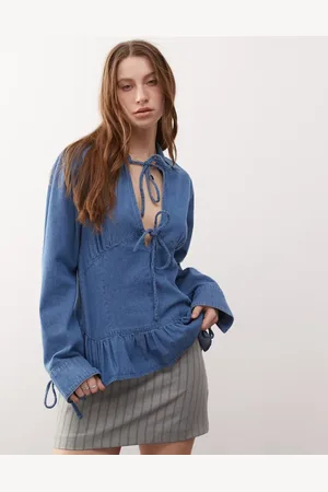 Reclaimed Long sleeve denim tie front top with peplum hem in mid