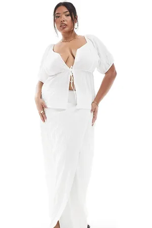 Esmée Exclusive tie side wrap maxi beach skirt in