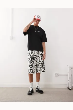COLLUSION Skater relaxed jersey shorts in cow print