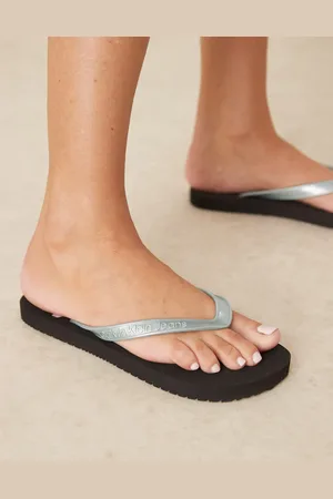 Calvin Klein Logo flip flops in and light blue