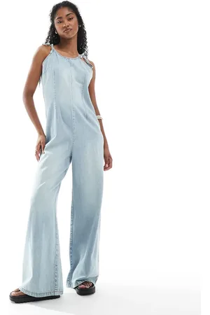 Monki Lightweight denim halter neck jumpsuit in wash