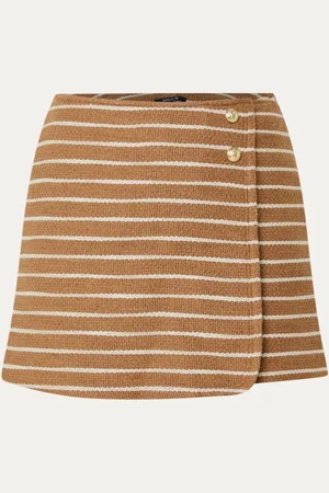 NIKKIE. Isaro mini broekrok met streepprint en sierknopen