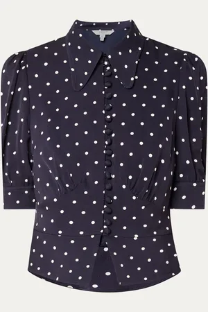 L.K. Bennett Elsie cropped blouse met stippenprint en pofmouw