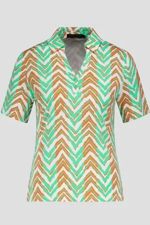 Claude Arielle Witte polo met oranje-groene print