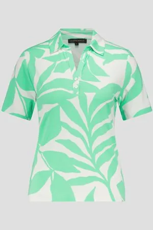 Claude Arielle Witte polo met groene bladerprint