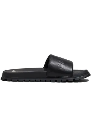 Marc Jacobs The Leather Slide logo