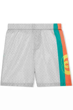 Gucci Shorts - Monogram panelled swim shorts