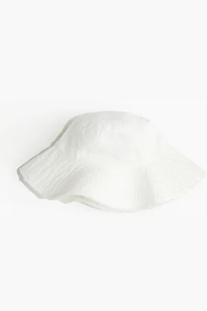 H&M Katoenen buckethat met gerafelde rand