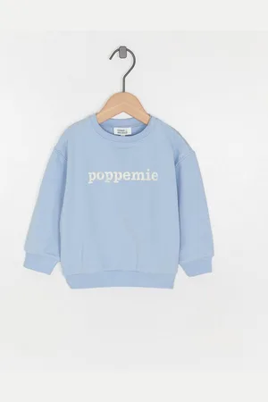 Cuddles and Smiles Blauwe Sweater Met Backprint, Poppemie