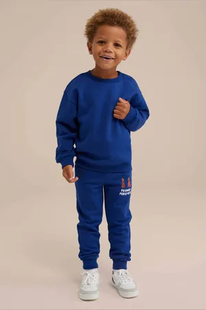 WE Fashion Slim fit broek met printopdruk kobalt blauw Jongens Katoen Printopdruk