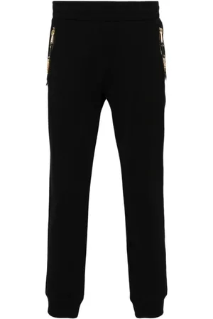 Moschino Broeken, Heren, Zwart, XL, Katoen, Zwarte broek met merkritssluiting en goudkleurige hardware