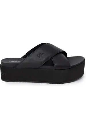 Calvin Klein Schoenen, Dames, Zwart, 39 EU, Leer, Sandalen met gekruiste bandjes en plateauzool