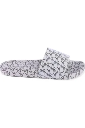 Calvin Klein Schoenen, Dames, Bruin, 41 EU, Bruine Monogram Patroon Slide
