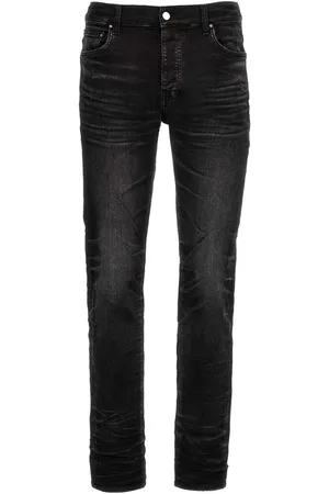 AMIRI Stack vervaagde zwarte jeans